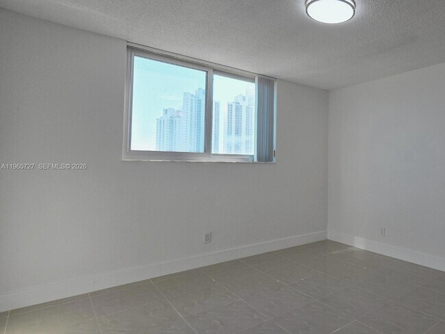 Building Photo - 19380 Collins Ave