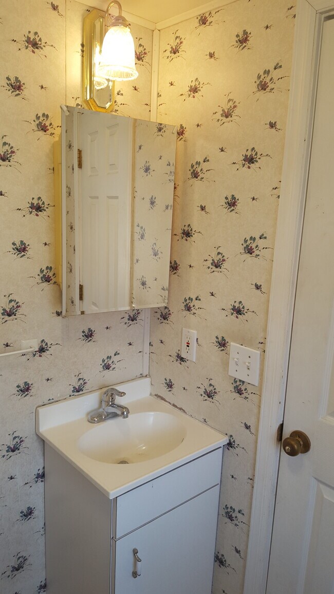 First floor half bath (before renovation) - 59 Park Ave