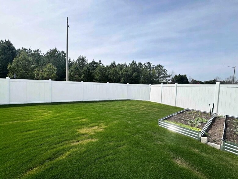 Raised garden beds included! Plants already sown and taken care of for season - 2300 Chavis Dr