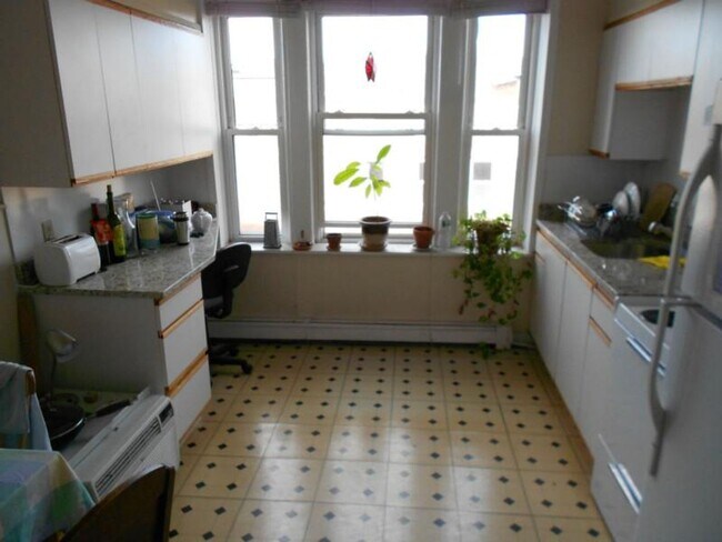 Building Photo - No Brokers Fee, No Security Deposit, Heat, Hot Water Included, Steps from the T Stop