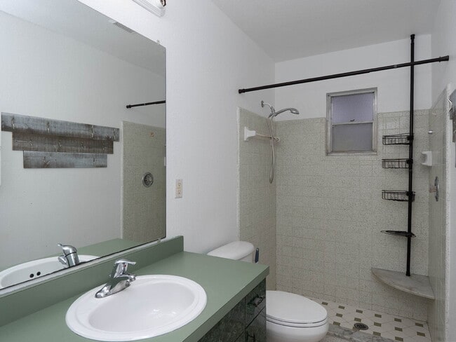 Building Photo - Recently painted 4BR/3BA home with tile floors throughout, fenced yard, detached garage, and prim...