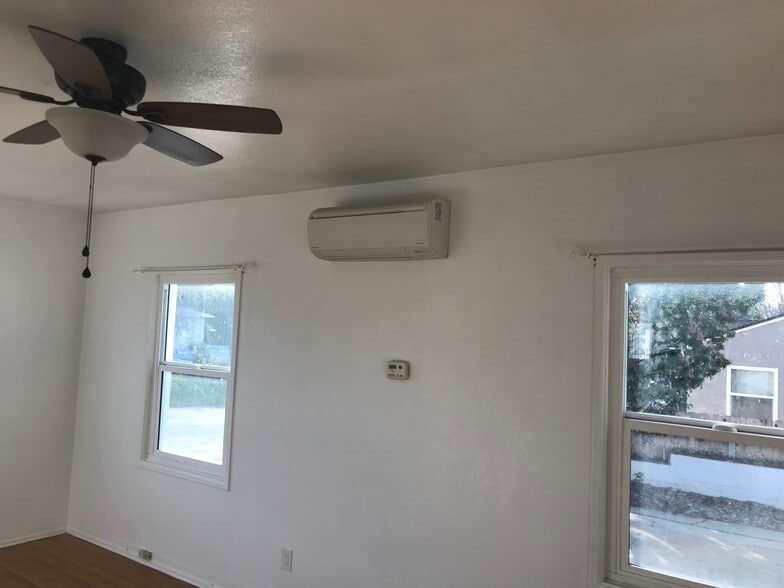 Another living room pick showing ductless AC and heat - 6980 Adams Ave