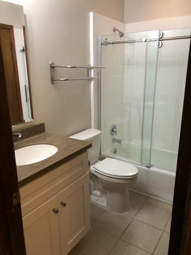 Full bath w/new vanity, glass shower door, Corian sink and tub surround - 23243 Rosewood Ct