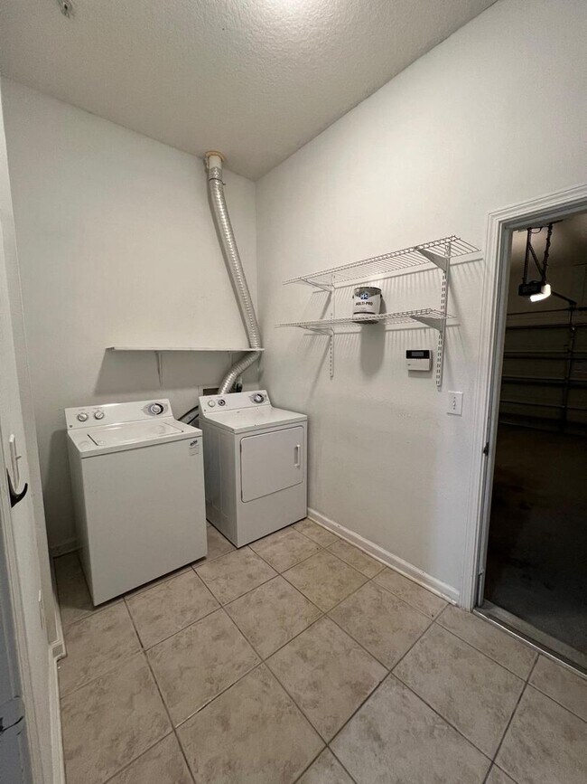 Building Photo - Spacious 3 bedroom condo located in a gated community off of Beach Boulevard