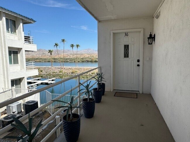 Building Photo - Riverfront 2BR 2BA Furnished Condo on GROUND LEVEL W/Garage and UTILITIES Included AVAIL 4/1/26