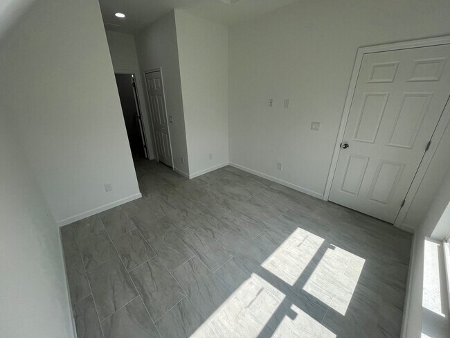 Building Photo - BRAND NEW MODERN SF HOME 3BD+den/2BA with GARAGE IN LEHIGH ACRES!