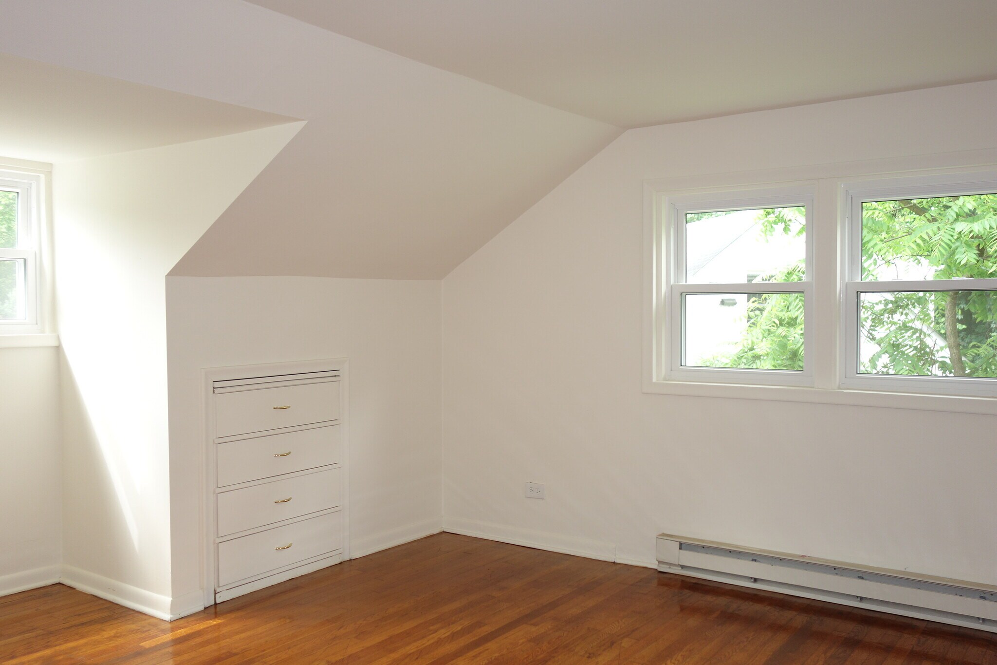 Second floor bedroom with hardwood floors and built in. - 116 Howard Dr