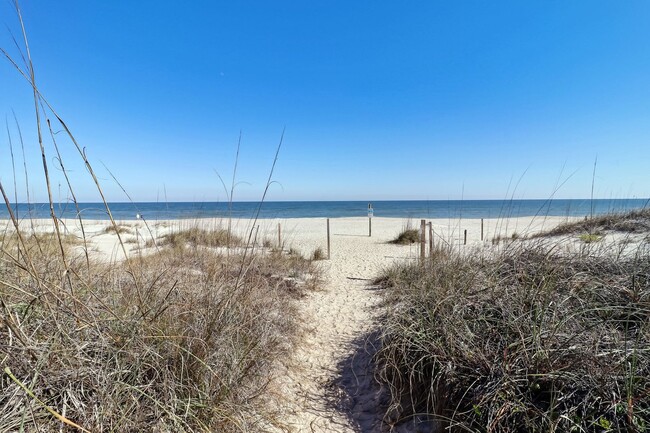 Building Photo - Live Steps from the Sand – Furnished Beach...