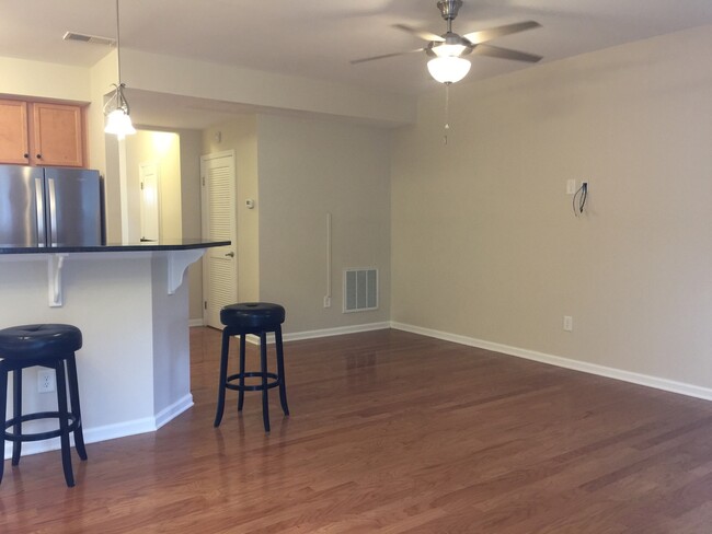 Building Photo - Move in ready townhome with garage and fen...