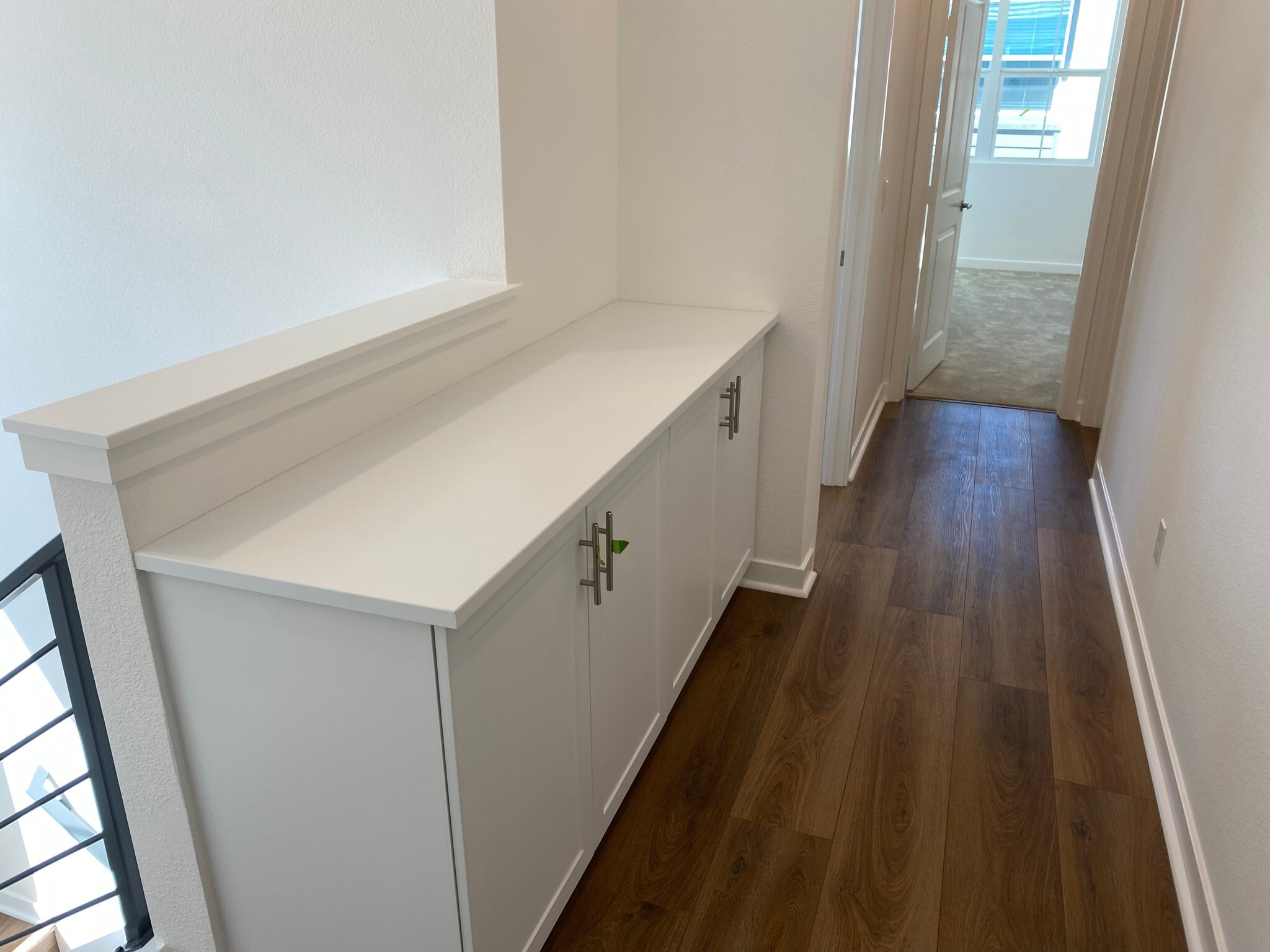 upstairs hallway with linen closet - 13086 Olympus Cir