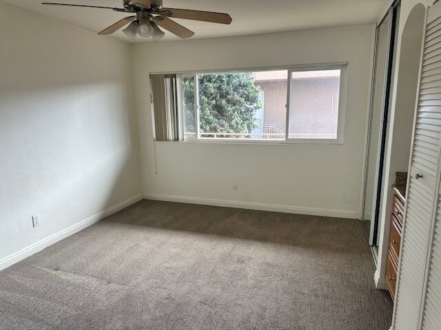 Spacious bedroom with ceiling fan and clean carpet - 5510 Adelaide Ave