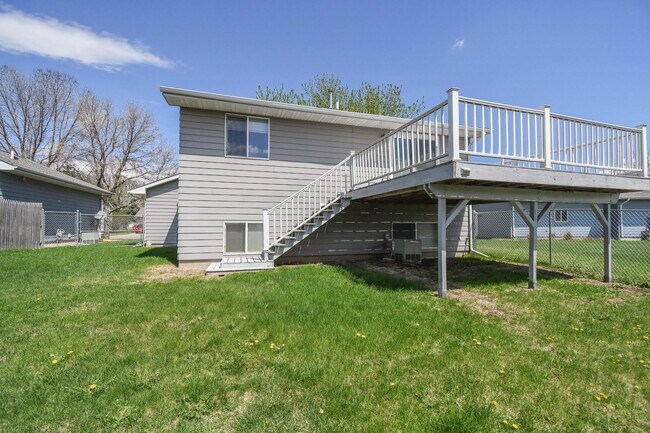 Building Photo - Updated 3BR Split-Level Home with Huge Deck, Fenced Yard & 2-Car Garage Near I-29!