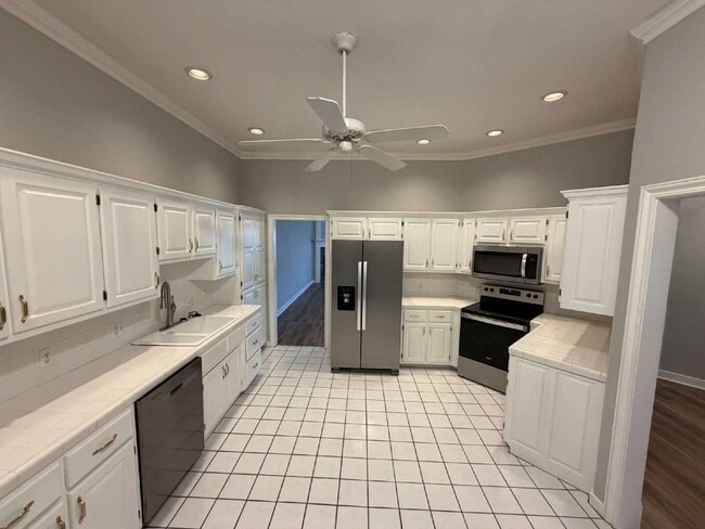 Building Photo - Elegant, Low Maintenance Townhome Designed for Elevated Everyday Living!