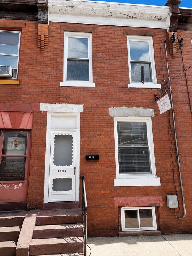 Building Photo - Bright 2BR Port Richmond Row Home with Large Living Space & Basement Storage