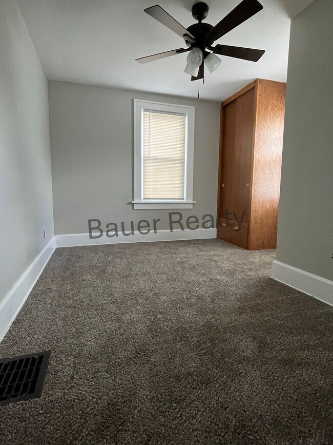 Building Photo - Three bedroom home with two car, detached garage!