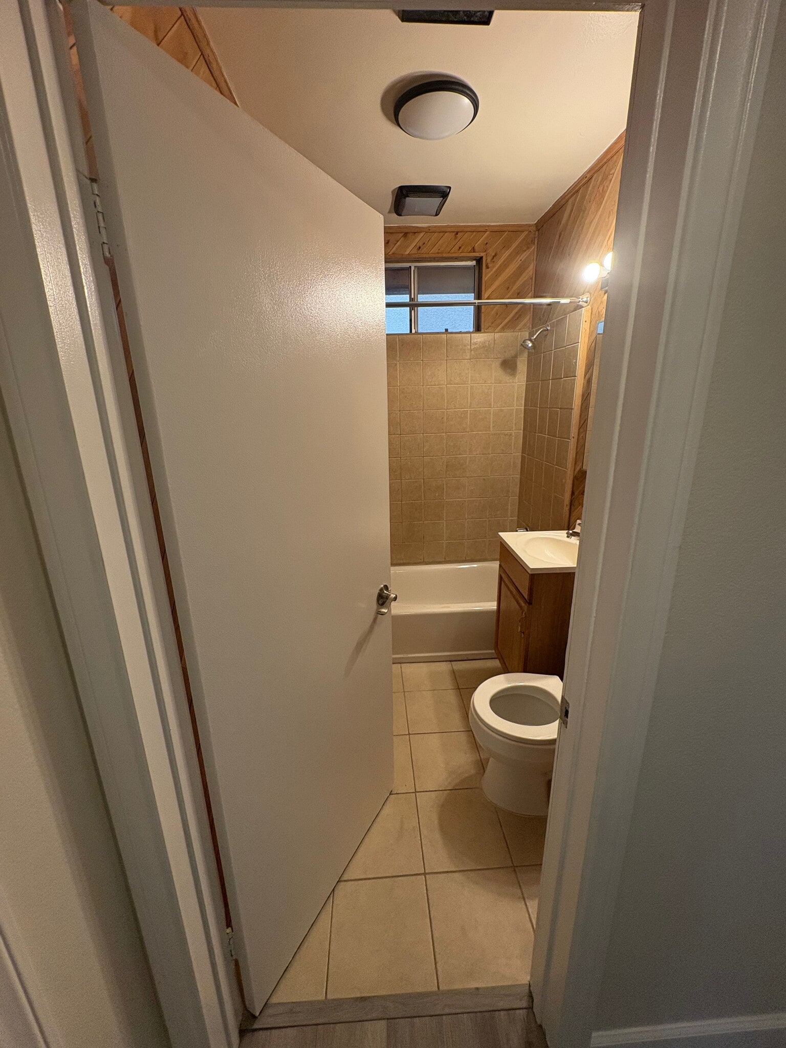 At the end of the hallway, the full bathroom - 23162 Smith Rd