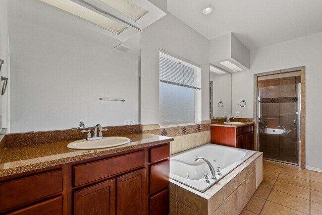 Building Photo - "Spacious 4-Bed Oasis with Granite Touches...
