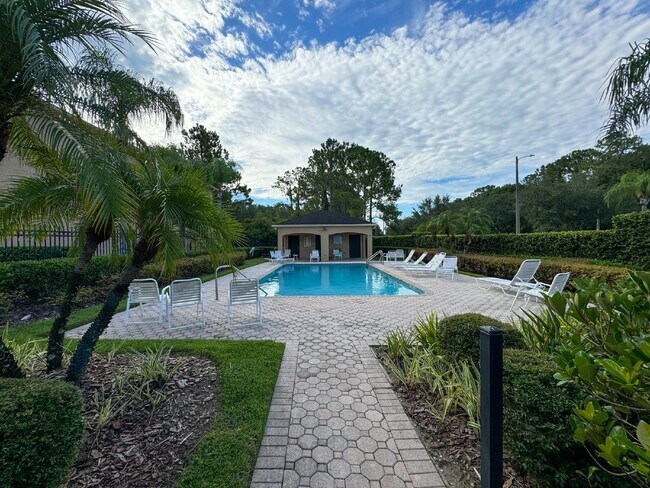 Building Photo - Gated Tampa Palms Townhome with 2-Car Garage, Screened Lanai & Community Pool