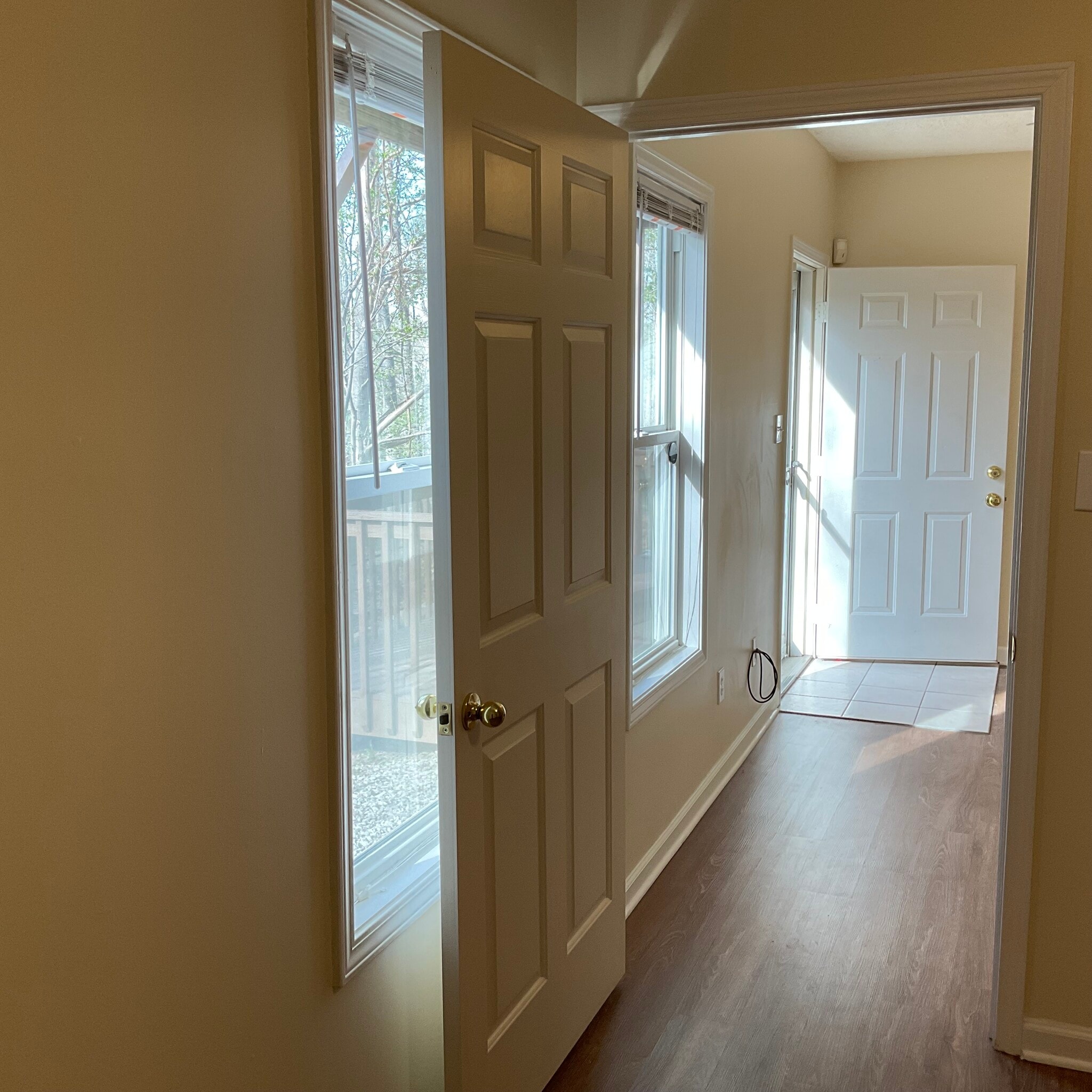 Bottom level access with glass storm door for more light. - 10 Hillsboro Dr