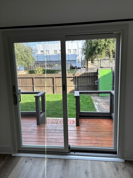 View of deck and front yard from front room - 713 Amoroso Pl