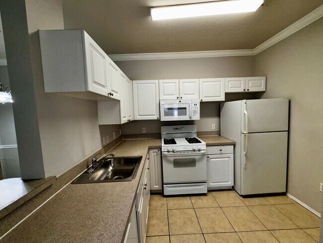 Building Photo - Spacious 2 Bed / 2 Bath Second-Floor Condo at Grand Reserve at Kirkman Park