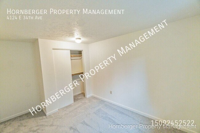Building Photo - 4124 E 34th Ave