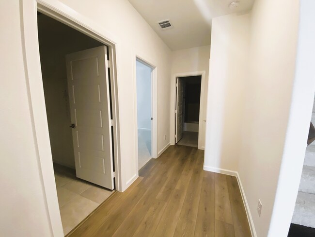 Hallway to Guest Room & Full Bath - 621 Hummingbird Dr