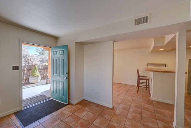 Unit 1011--Walk into open space with two rooms off a kitchen - 2210 Miguel Chavez Rd