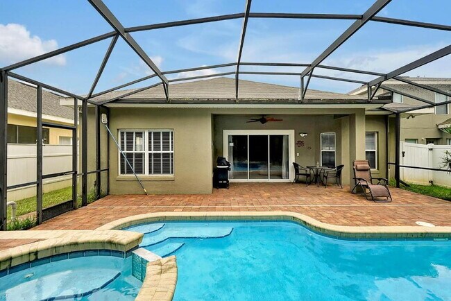 Building Photo - "Stunning 3BR Orlando Home with Private Screened Pool, Spa & Spacious Living Areas"