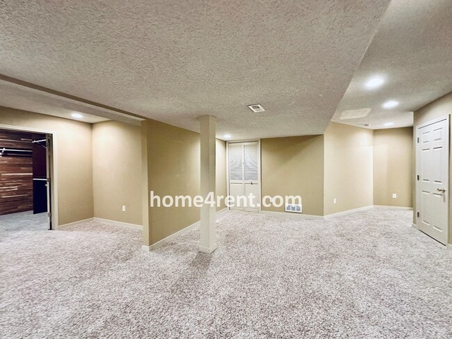 Building Photo - Maintenance Free! Main level Master, Finished Basement and Wood Floors in the Kitchen! *Brand New...