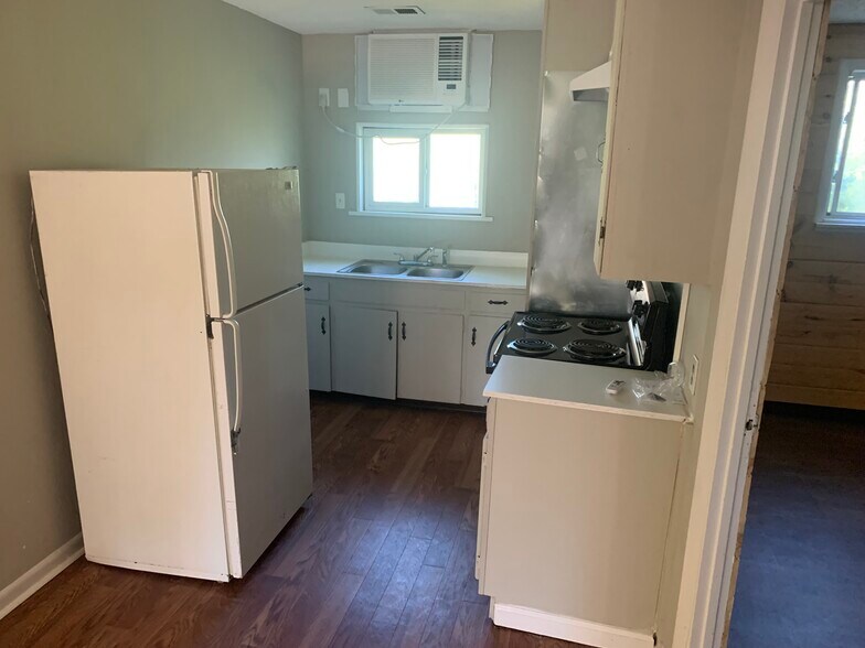 2 Bedroom unit kitchen. - 125 E Frontage Rd