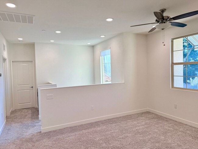 Building Photo - Stunning 3-Bed/2.5-Bath End Unit Condo with Solar & Large Yard