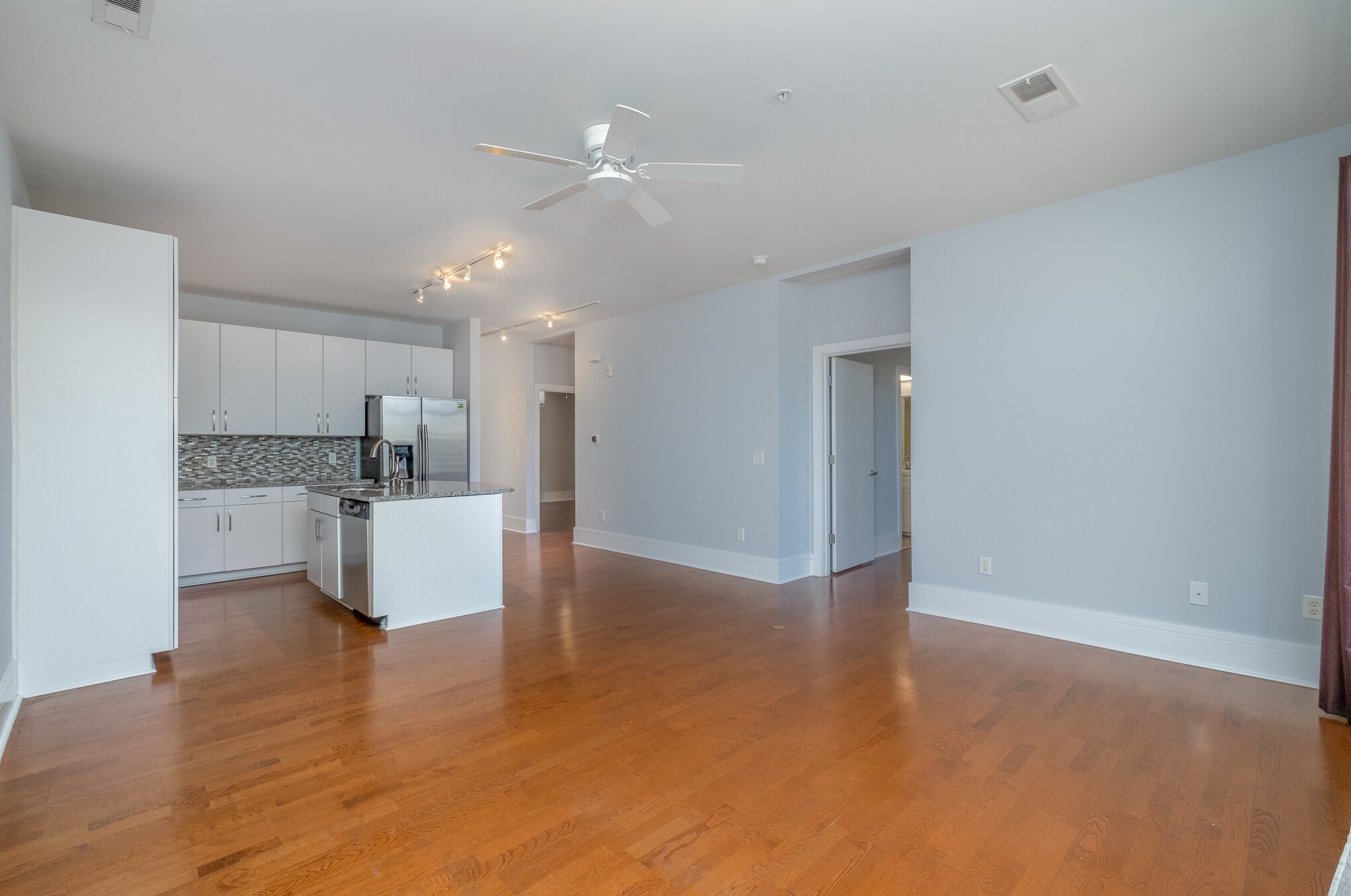 From the living room looking at the kitchen, dining area, doorways to the master and 2nd bedrooms - 1600 Fulton Ave