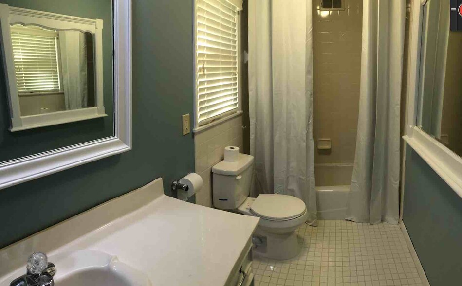 Bathroom 2 off of bedroom 3. A lot of built-in mirrors and vanity room - 4968 New Haven Ave