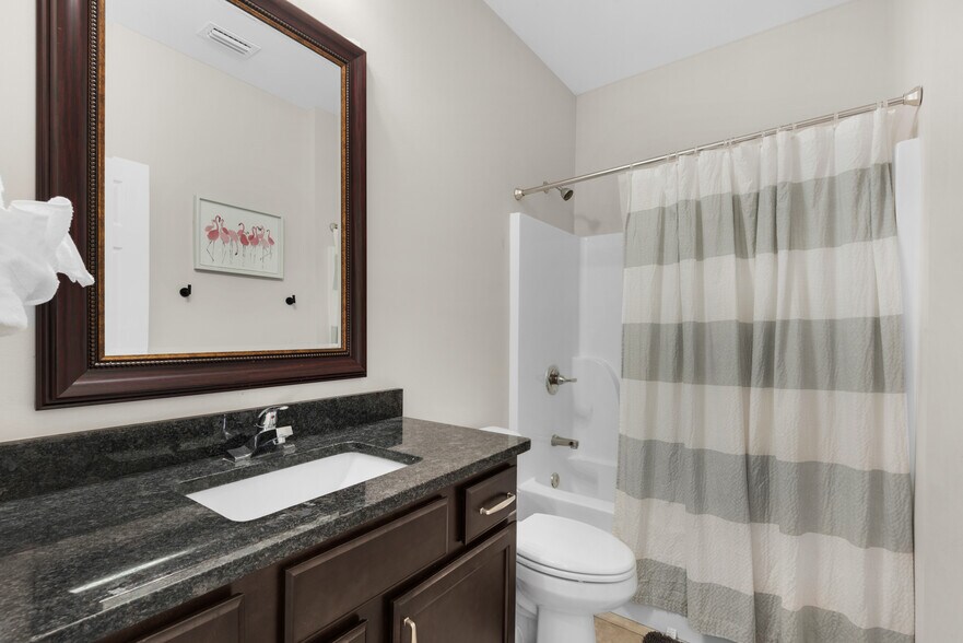 Guest bathroom with fresh towels, a hair dryer, shampoo, soap, and conditioner - 28 Snook Rd