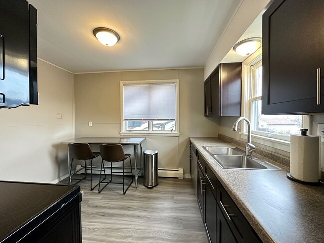 Building Photo - Available June 1st - Beautifully Renovated 4 Bed 1 Bath w/ Garage