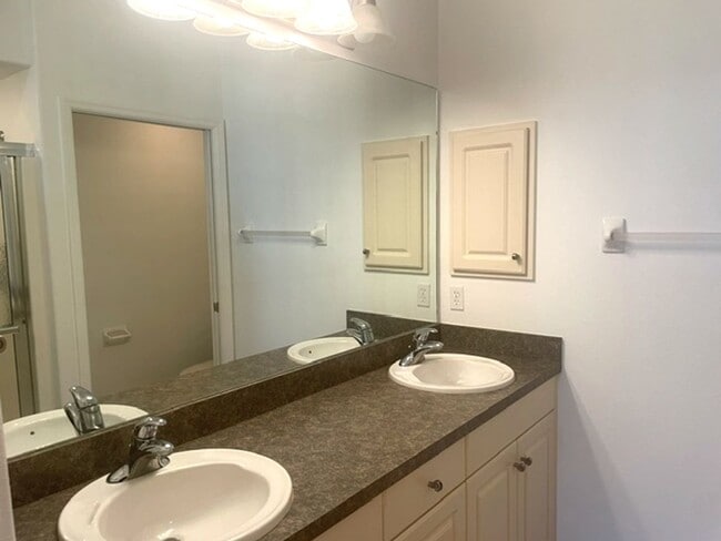 Building Photo - Elegant 3 Bedroom End-Unit Condo with Screened Lanai & Pond Views and A Private Garage