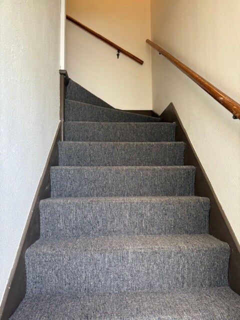 Hallway to upstairs - 2701 E Saginaw St