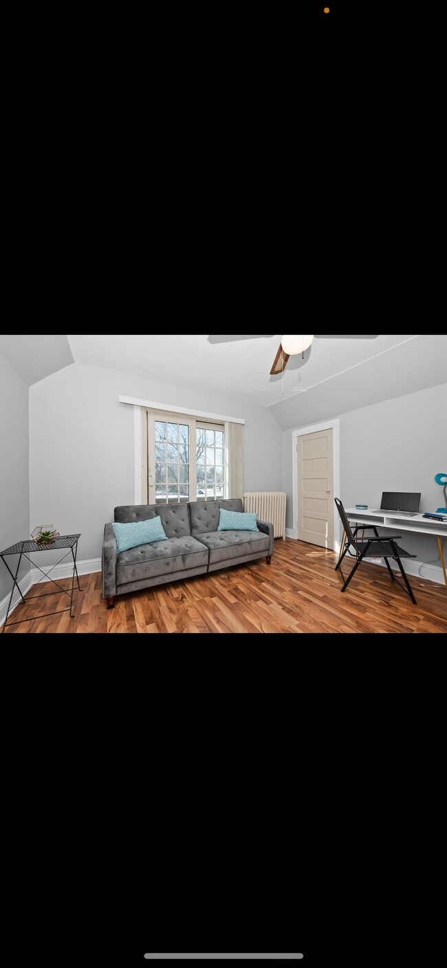 Bonus room with a desk and futon - 10109 S Prospect Ave