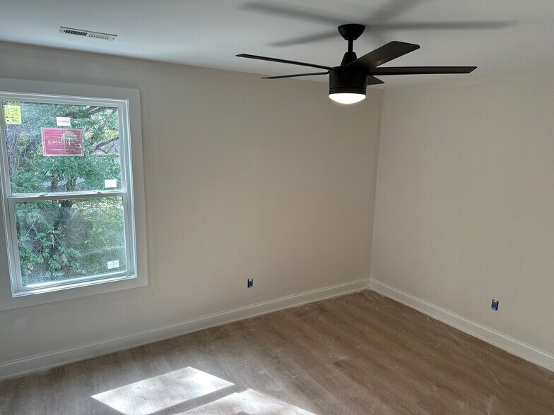 guest bedroom with walk-in closet - 200 Raymond St