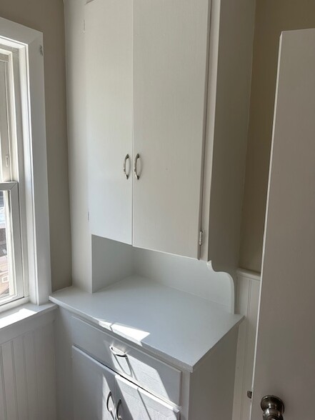 Cabinet in 1/2 bath downstairs - 630 S Main St