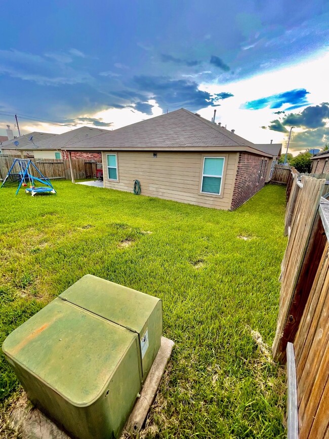 Backyard with Covered Patio Perfect for Morning Coffee - 1939 Manor Dr