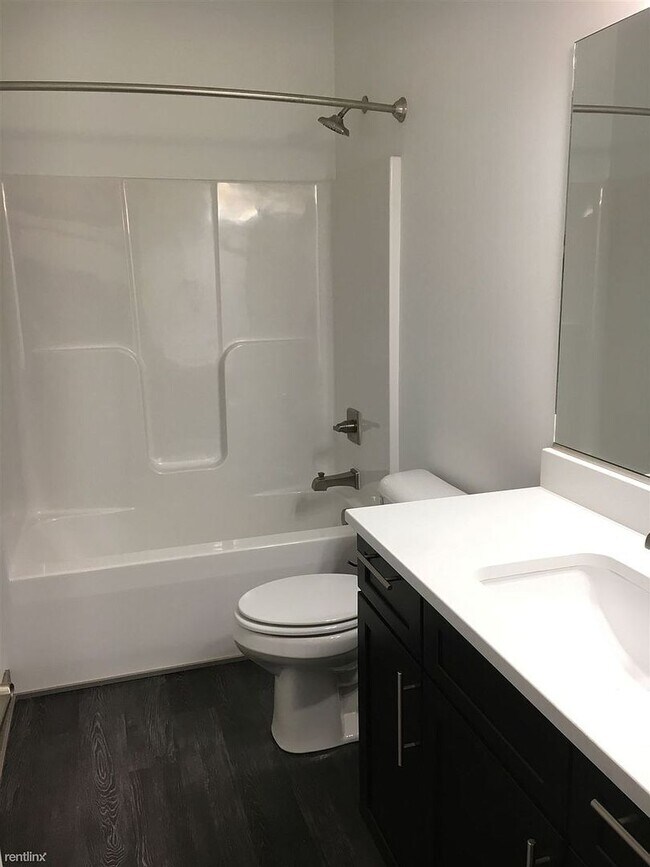 Building Photo - Spacious 4 bedroom/3 bath home with finished lower level and attached 2 car garage