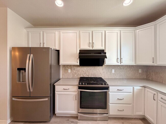 Building Photo - Move-In Ready 3-Story Townhome with Loft & 2-Car Garage