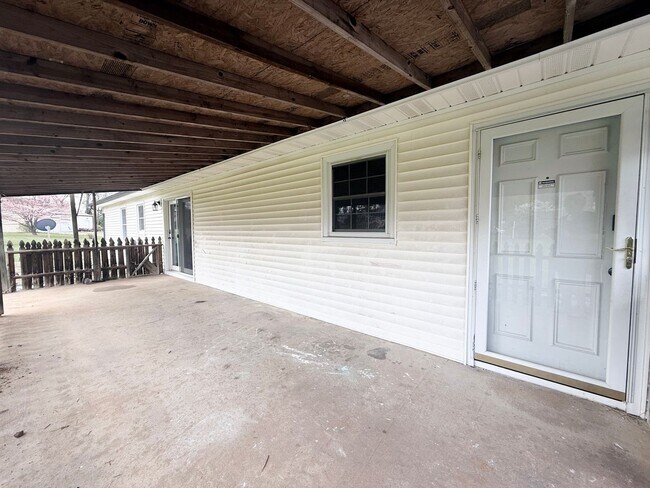 Building Photo - Spacious 3-Bedroom Home with Huge Yard, Covered Porches & Storage Building