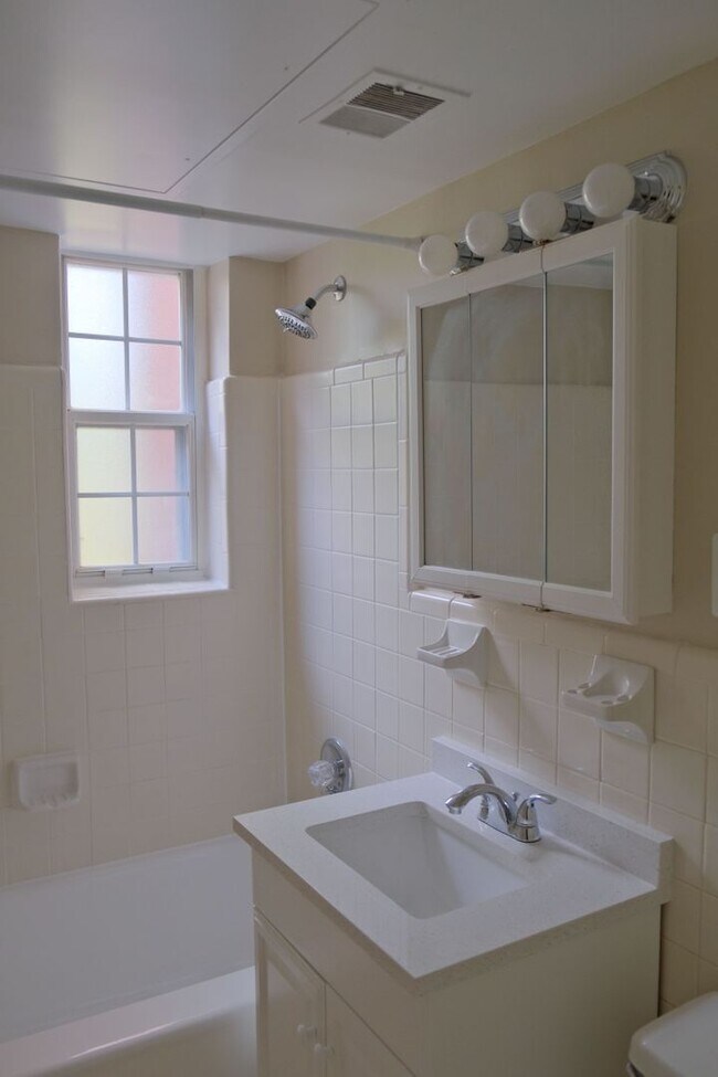 Building Photo - Beautiful corner unit in a secure, all-brick, pet-friendly building