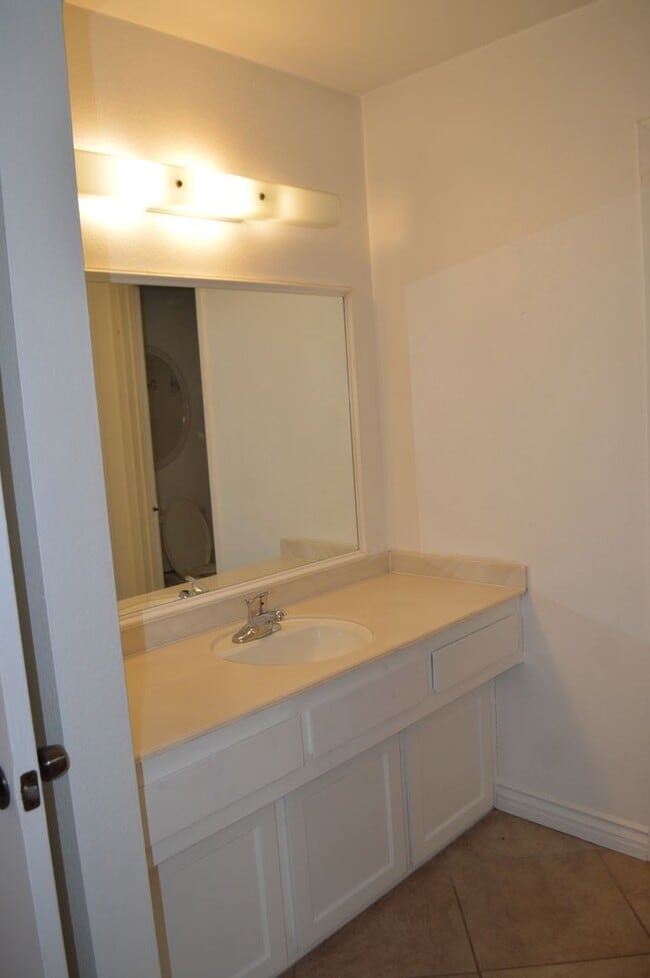 Building Photo - Four Bedroom, Two Bathroom Single Story Home With Two Car Garage