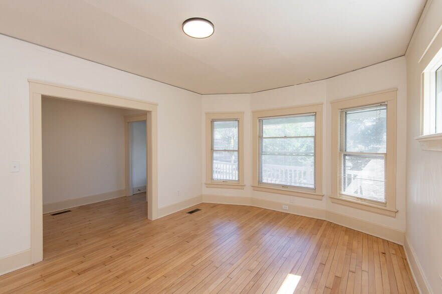 Living Room with Bay Windows - 2415 N Murray Ave