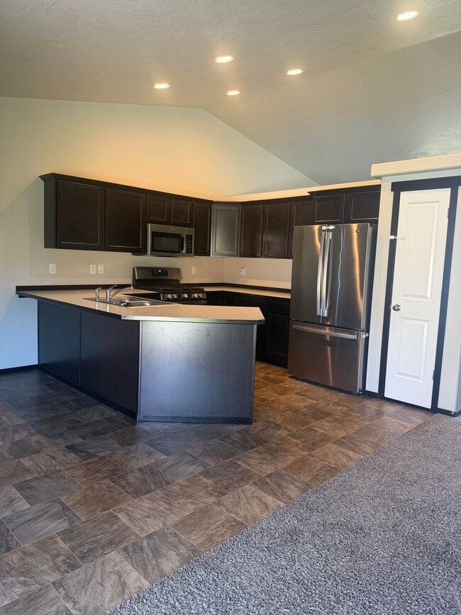 Building Photo - Lots of storage space in this 4- Car garage for all your playthings!!