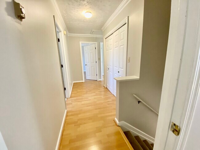 Hallway upstairs to the bedrooms, bathrooms, and laundry area - 2160 Heritage Trace Ln
